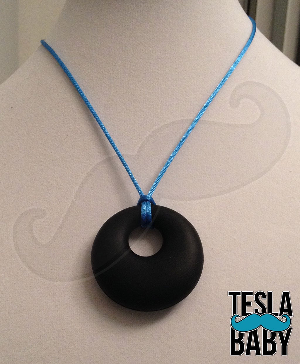 Silicone Pendant Necklace --  A 2 1/8" pink silicone circular pendant; for fidgeting, sensory play, or teething.