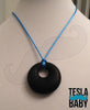 Silicone Pendant Necklace --  A 2 1/8" white silicone circular pendant; for fidgeting, sensory play, or teething.